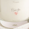 Close up fo candle label with words 'I Love You' and heart picture underneath