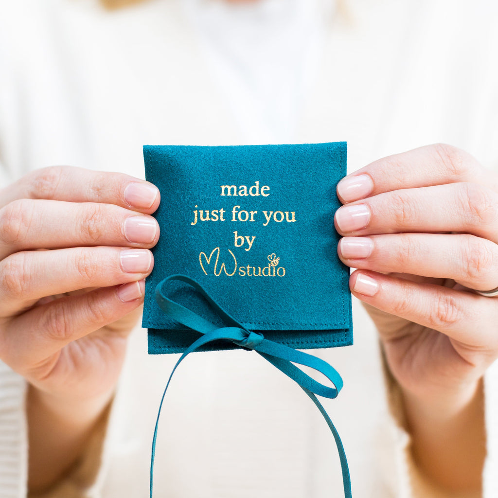 MW Studio gift pouch in hands